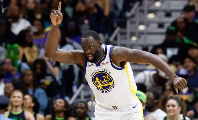 Golden State Warriors forward Draymond Green reacts after a basket against the New Orleans Pelicans during the third quarter of an NBA basketball game, Sunday, Nov. 16, 2025, in New Orleans. (AP Photo/Butch Dill)