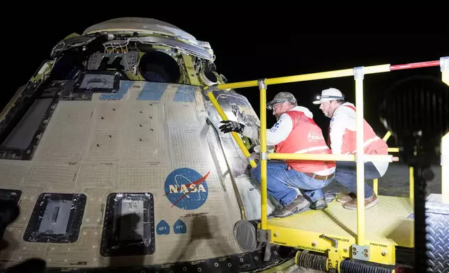 FILE - In this photo provided by NASA, Boeing and NASA teams work around NASA's Boeing Crew Flight Test Starliner spacecraft after it landed uncrewed, Sept. 6, 2024, at White Sands, New Mexico, after undocking from the International Space Station. (Aubrey Gemignani/NASA via AP, File)