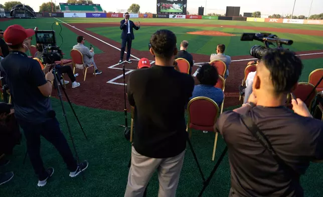 Baseball United CEO and co-founder Kash Shaikh speaks to journalists ahead of the league's inaugural season at the new Barry Larkin Field in Ud al-Bayda outside of Dubai, United Arab Emirates, Thursday, Nov. 13, 2025. (AP Photo/Fatima Shbair)
