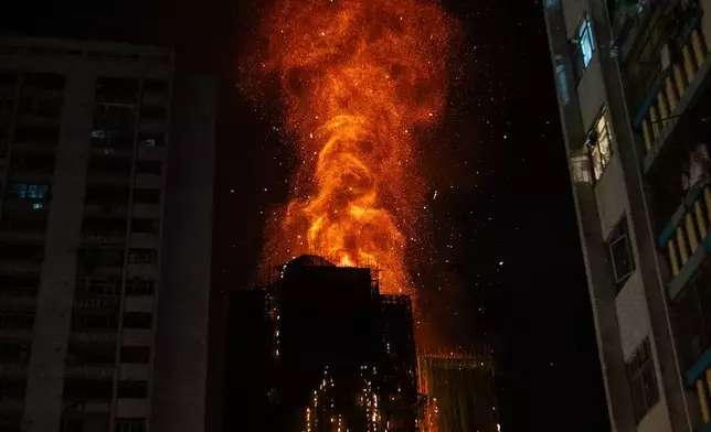 Flames engulf a building after a fire broke out at Wang Fuk Court, a residential estate in the Tai Po district of Hong Kong's New Territories, Wednesday, Nov. 26 2025. (AP Photo/Chan Long Hei)