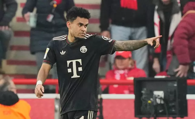 Bayern's Luis Diaz celebrates after scoring his side's opening goal during the Bundesliga soccer match between Union Berlin and FC Bayern Munich in Berlin, Germany, Saturday, Nov. 8, 2025. (AP Photo/Martin Meissner)
