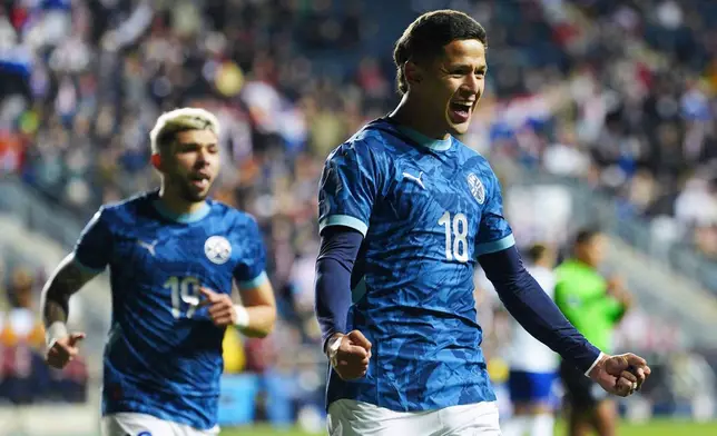 Paraguay's Alex Arce (18) celebrates after scoring a goal during the first half of an international friendly soccer match against the United States, Saturday, Nov. 15, 2025, in Chester, Pa. (AP Photo/Derik Hamilton)