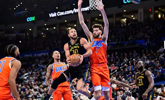 Golden State Warriors guard Stephen Curry (30) looks to shoot against Oklahoma City Thunder center/forward Chet Holmgren (7) during the first half of an NBA basketball game, Tuesday, Nov. 11, 2025, in Oklahoma City. (AP Photo/Gerald Leong)