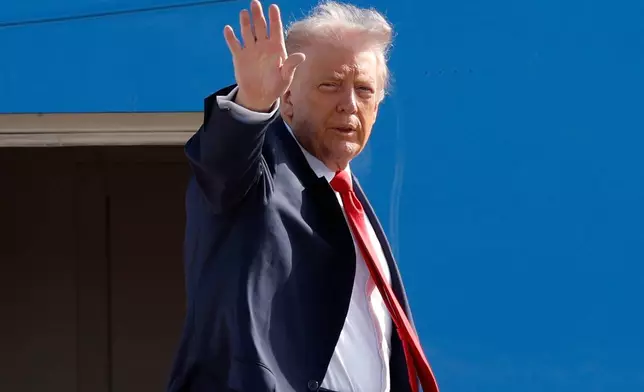 President Donald Trump waves from the stairs of Air Force One as he boards upon his arrival at Joint Base Andrews, Md., Friday, Oct. 31, 2025, en route to his Mar-a-Lago estate in Palm Beach, Fla. (AP Photo/Luis M. Alvarez)
