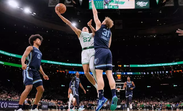 Boston Celtics guard Jordan Walsh (27) drives to the basket against Memphis Grizzlies center Jock Landale (31) during the first half of an NBA basketball game, Wednesday, Nov. 12, 2025, in Boston. (AP Photo/Charles Krupa)