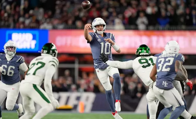New England Patriots quarterback Drake Maye passes during the second half of an NFL football game against the New York Jets, Thursday, Nov. 13, 2025, in Foxborough, Mass. (AP Photo/Robert F. Bukaty)