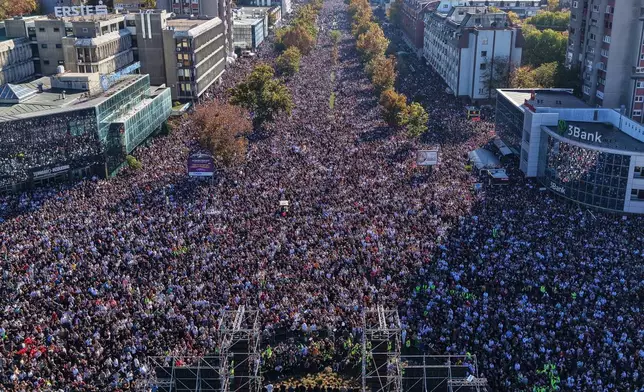 People fill the streets near the train station before observing 16 minutes of silence for the victims on the first anniversary of the disaster that killed 16 people, in Novi Sad, Serbia, Saturday, Nov. 1, 2025. (AP Photo/Armin Durgut)