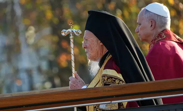 Pope Leo XIV and the Ecumenical Patriarch Bartholomew I, left, lead an Ecumenical prayer service near the archaeological excavations of the ancient Basilica of Saint Neophytos, in Iznik, Turkey, Friday, Nov. 28, 2025. (AP Photo/Domenico Stinellis)