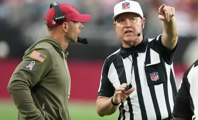 Arizona Cardinals head coach Jonathan Gannon, left, reacts as referee Carl Cheffers gestures during the second half of an NFL football game between the Cardinals and the San Francisco 49ers in Glendale, Ariz., Sunday, Nov. 16, 2025. (AP Photo/Ross D. Franklin)