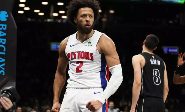 Detroit Pistons guard Cade Cunningham (2) reacts after scoring and drawing a foul during the second half of an NBA Cup basketball game against the Brooklyn Nets, Friday, Nov. 7, 2025, in New York. (AP Photo/Heather Khalifa)