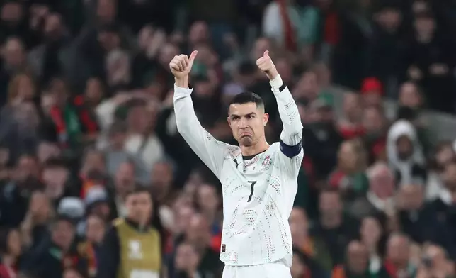 Portugal's Cristiano Ronaldo leaves the pitch after being shown a red card during a World Cup 2026 group F qualifying soccer match between Ireland and Portugal in Dublin, Thursday, Nov. 13, 2025. (AP Photo/Peter Morrison)