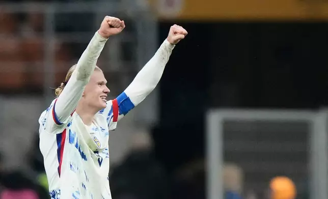 Norway's Erling Haaland celebrates after scoring his side's third goal during the 2026 World Cup Group I qualifier soccer match between Italy and Norway in Milan, Italy, Sunday, Nov. 16, 2025. (AP Photo/Luca Bruno)