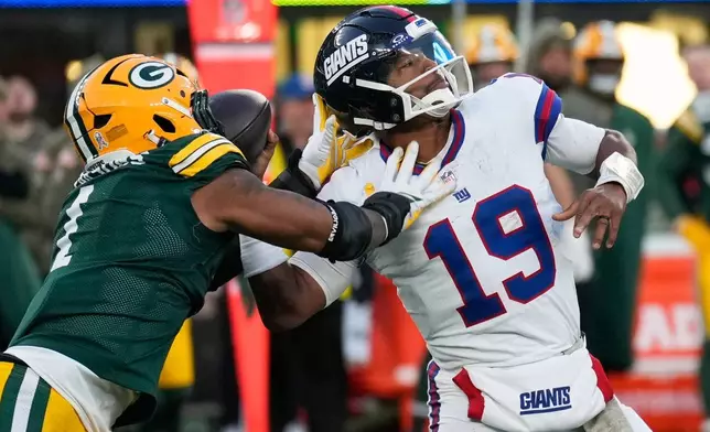 Green Bay Packers' Micah Parsons knocks the ball from New York Giants' Jameis Winston on the final play of the game Sunday, Nov. 16, 2025, in East Rutherford, N.J. (AP Photo/Seth Wenig)