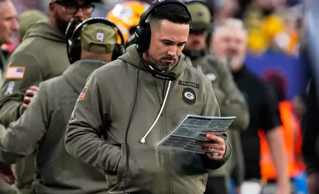 Green Bay Packers head coach Matt LaFleur looks at his play sheet during the second half of an NFL football game against the New York Giants Sunday, Nov. 16, 2025, in East Rutherford, N.J. (AP Photo/Frank Franklin II)