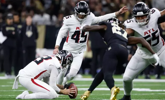 Atlanta Falcons placekicker Zane Gonzalez (45) boots a field goal against the New Orleans Saints in the first half of an NFL football game, Sunday, Nov. 23, 2025, in New Orleans. (AP Photo/Butch Dill)