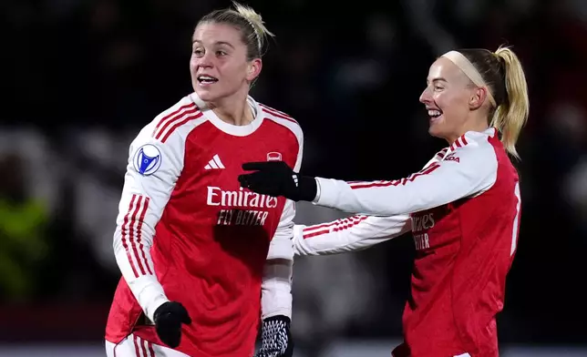 Arsenal's Alessia Russo, left, celebrates scoring with Chloe Kelly during the Women's Champions League soccer match between Arsenal and Real Madrid in Borehamwood, England, Wednesday, Nov. 19, 2025. (John Walton/PA via AP)