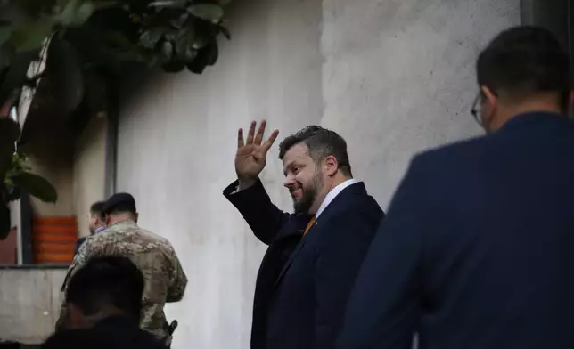 Presidential candidate Johannes Kaiser of the National Libertarian Party, waves after voting during general elections in Santiago, Chile, Sunday, Nov. 16, 2025. (AP Photo/Cristobal Escobar)