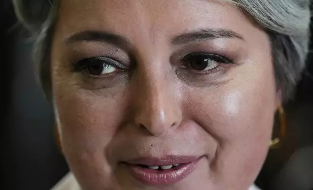 Presidential candidate Jeannette Jara of the Unidad por Chile coalition arrives to vote during general elections in Santiago, Chile, Sunday, Nov. 16, 2025. (AP Photo/Natacha Pisarenko)