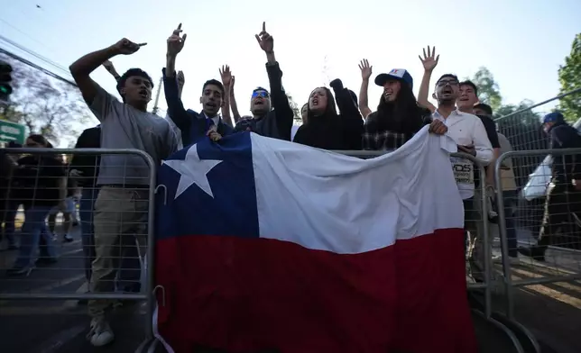 Supporters of presidential candidate Jose Antonio Kast of the Republican Party react after the polls closed in general elections in Santiago, Chile, Sunday, Nov. 16, 2025. (AP Photo/Esteban Felix)