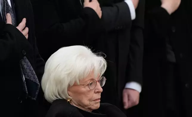 Wife of former Vice President Dick Cheney, Lynne Cheney and family preside over the arrival of the casket of former Vice President Dick Cheney at the Washington National Cathedral, Thursday, Nov. 20, 2025, in Washington. (AP Photo/Mark Schiefelbein)