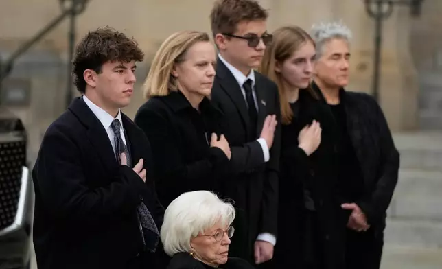 Wife of former Vice President Dick Cheney, Lynne Cheney in wheelchair, along with family preside over the arrival of the casket of former Vice President Dick Cheney at the Washington National Cathedral, Thursday, Nov. 20, 2025, in Washington. (AP Photo/Mark Schiefelbein)