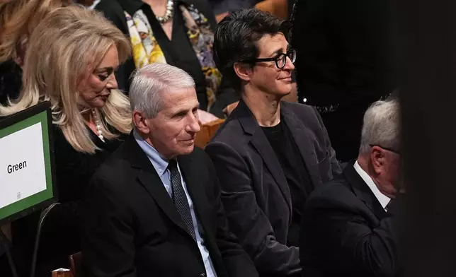 Former Director of the National Institute of Allergy and Infectious Diseases Anthony Fauci and television host Rachel Maddow and other invited guests, are seated before the funeral service for former Vice President Dick Cheney at the Washington National Cathedral, Thursday, Nov. 20, 2025 in Washington. (AP Photo/Matt Rourke)