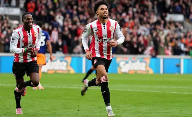 Brentford's Kevin Schade celebrates scoring their side's first goal during the English Premier League soccer match between Brentford and Newcastle United in London, Sunday, Nov. 9, 2025. (Adam Davy/PA via AP)