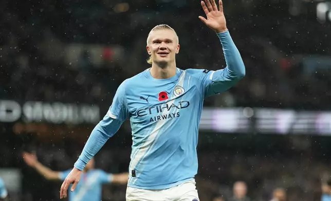 Manchester City's Erling Haaland celebrates after scoring his side's opening goal during the English Premier League soccer match between Manchester City and Liverpool in Manchester, England, Sunday, Nov. 9, 2025. (AP Photo/Jon Super)
