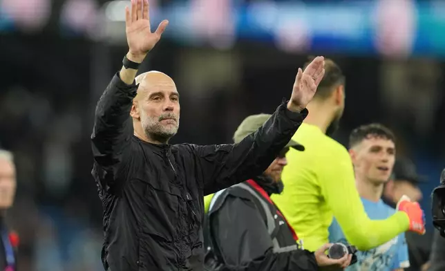 Manchester City's head coach Pep Guardiola leaves the field at the end of the English Premier League soccer match between Manchester City and Liverpool in Manchester, England, Sunday, Nov. 9, 2025. (AP Photo/Jon Super)