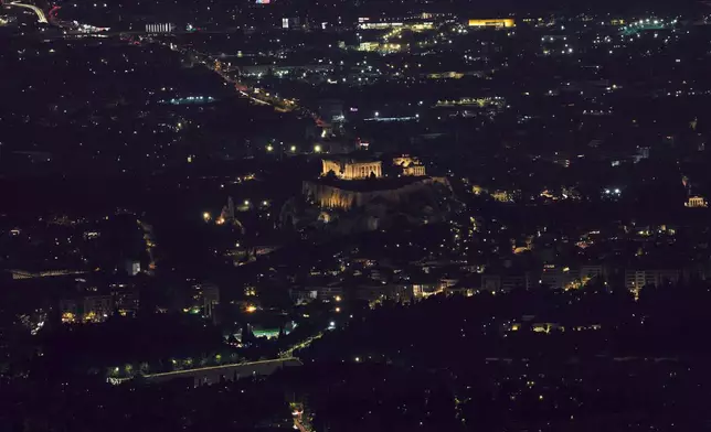 A general view of the city of Athens with the 5th century B.C. Parthenon temple atop the Acropolis hill on Sunday, Nov. 2 , 2025. (AP Photo/Petros Giannakouris)