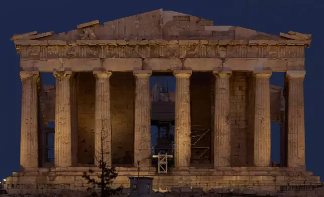 The 5th century B.C. Parthenon temple stands on the Acropolis hill in Athens, on Saturday, Oct. 25, 2025. (AP Photo/Petros Giannakouris)