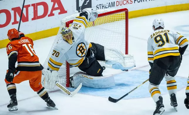 Anaheim Ducks center Ryan Strome (16) scores against Boston Bruins goaltender Joonas Korpisalo (70) during the second period of an NHL hockey game Wednesday, Nov. 19, 2025, in Anaheim, Calif. (AP Photo/Ethan Swope)