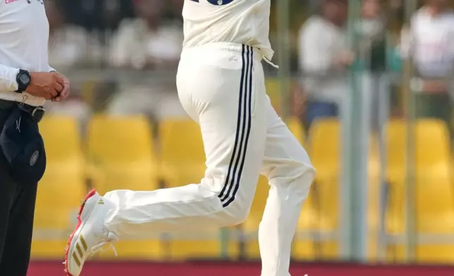 India's Kuldeep Yadav bowls a delivery on the second day of the second cricket test match between India and South Africa in Guwahati, India, Saturday, Nov. 22, 2025. (AP Photo/Anupam Nath)