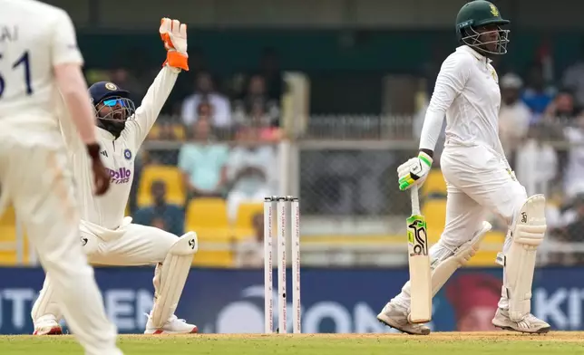 India's captain Rishab Pant appeals unsuccessfully for the wicket of South Africa's Senuran Muthusamy on the second day of the second cricket test match between India and South Africa in Guwahati, India, Saturday, Nov. 22, 2025. (AP Photo/Anupam Nath)