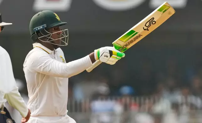 South Africa's Senuran Muthusamy celebrates after scoring fifty runs on the second day of the second cricket test match between India and South Africa in Guwahati, India, Saturday, Nov. 22, 2025. (AP Photo/Anupam Nath)