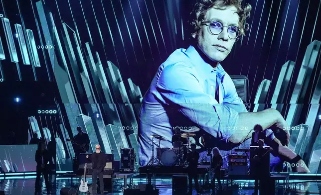 David Letterman, alongside the guitar that Warren Zevon gave to him, speaks during the 2025 Rock and Roll Hall of Fame Induction Ceremony on Saturday, Nov. 8, 2025, at L.A. Live in Los Angeles. (AP Photo/Chris Pizzello)