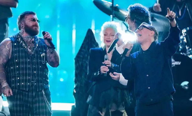 Teddy Swims, from left, Cyndi Lauper and Bryan Adams perform during the 2025 Rock and Roll Hall of Fame Induction Ceremony on Saturday, Nov. 8, 2025, at L.A. Live in Los Angeles. (AP Photo/Chris Pizzello)