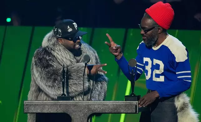 Inductees Big Boi, left and André 3000 of OutKast during the 2025 Rock and Roll Hall of Fame Induction Ceremony on Saturday, Nov. 8, 2025, at L.A. Live in Los Angeles. (AP Photo/Chris Pizzello)