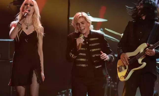 Taylor Momsen, from left, performs with Brandi Carlile and inductee Hiro Yamamoto of Soundgarden, during the 2025 Rock and Roll Hall of Fame Induction Ceremony on Saturday, Nov. 8, 2025, at L.A. Live in Los Angeles. (AP Photo/Chris Pizzello)