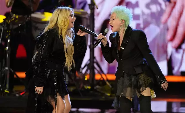 Avril Lavigne, left and Cyndi Lauper perform during the 2025 Rock and Roll Hall of Fame Induction Ceremony on Saturday, Nov. 8, 2025, at L.A. Live in Los Angeles. (AP Photo/Chris Pizzello)