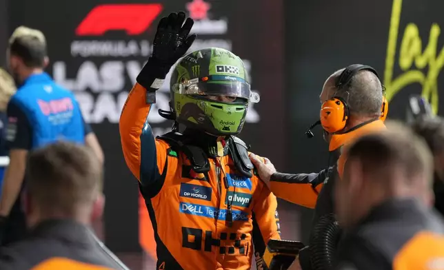 McLaren driver Lando Norris of Great Britain celebrates after a qualifying session at the Formula One Las Vegas Grand Prix auto race, Friday, Nov. 21, 2025 in Las Vegas. (AP Photo/Eric Gay)