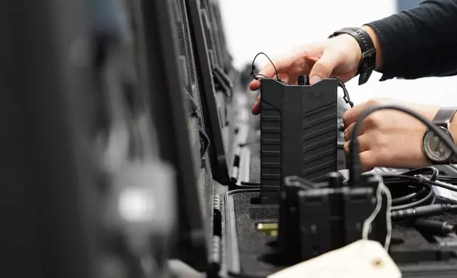 A worker packs away assembled counter drone devices at MyDefence's headquarters in Alborg, Denmark, on Oct. 28, 2025. (AP Photo/James Brooks)