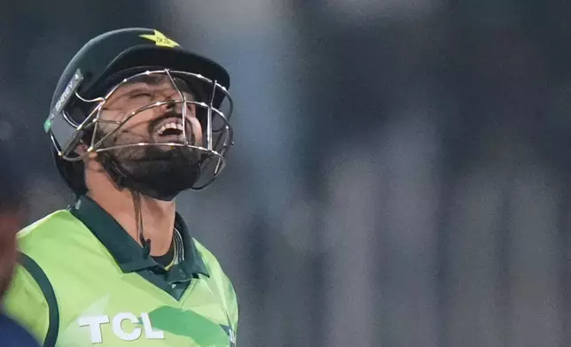 Pakistan's Babar Azam reacts after his century during the second one day international cricket match between Pakistan and Sri Lanka, in Rawalpindi, Pakistan, Friday, Nov. 14, 2025. (AP Photo/Anjum Naveed)