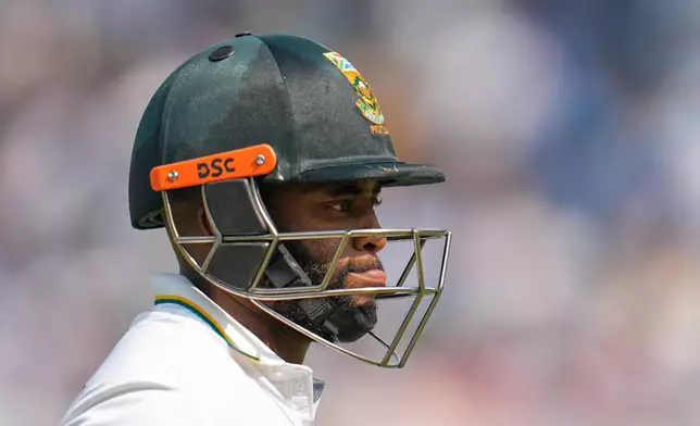 South Africa's captain Temba Bavuma leaves the field at the end of their second innings on the third day of the first cricket test match between India and South Africa in Kolkata, India, Sunday, Nov. 16, 2025. (AP Photo/Aijaz Rahi)