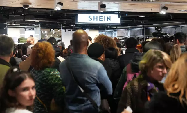 People visit the BHV department store as fast fashion powerhouse Shein opens its first permanent store, Wednesday, Nov. 5, 2025 in Paris. (AP Photo/Thibault Camus)