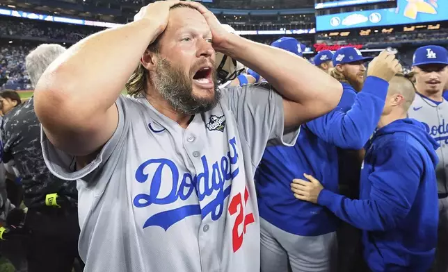 Los Angeles Dodgers pitcher Clayton Kershaw celebrates after the Dodgers defeated the Toronto Blue Jays in Game 7 of baseball's World Series, Sunday, Nov. 2, 2025, in Toronto. (Frank Gunn/The Canadian Press via AP)