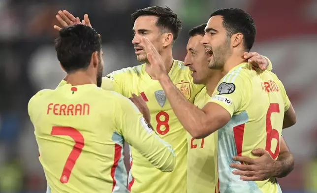 Spain's players celebrate after scoring their side's first goal scored by Spain's Mikel Oyarzabal during a World Cup 2026 group E qualifying soccer match between Georgia and Spain in Tbilisi, Georgia, Saturday, Nov. 15, 2025. (AP Photo/Tamuna Kulumbegashvili)