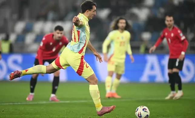 Spain's Mikel Oyarzabal scores his side's opening goal during a World Cup 2026 group E qualifying soccer match between Georgia and Spain in Tbilisi, Georgia, Saturday, Nov. 15, 2025. (AP Photo/Tamuna Kulumbegashvili)