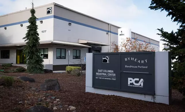 A sign for ByHeart, a manufacturer of organic baby formula, is displayed outside a building that houses a plant for the company on Tuesday, Nov. 11, 2025, in Portland, Ore. (AP Photo/Jenny Kane)