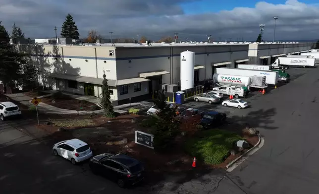 A sign for ByHeart, a manufacturer of organic baby formula, is displayed outside a building that houses a plant for the company on Tuesday, Nov. 11, 2025, in Portland, Ore. (AP Photo/Jenny Kane)
